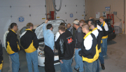 Students and instructors check out a natural-gas powered car and equipment used in biodiesel production.