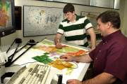 WVU mining engineering professor Keith Heasley, right, and recent graduate Kevin Rakes digitize a map of an abandoned mine. With deaths in the nation’s coal mines at a five-year high, WVU is taking a critical step toward making the industry safer by