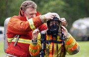 Participants in the WVU Fire Service Extension\'s State Fire School learn how to properly don rescue gear.  This year marks the 75th anniversary of the academy which has helped to train thousands of emergency responders over the years.
