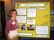 Jennifer Beach from the Department of Chemistry stands beside her poster \"Stability of Color Reagents Over Time\" in the state Capitol as part of the Third Annual West Virginia Undergraduate research Day at the state Capitol.
