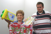 It may be hot and humid outside, but it feels like Christmas in July with WVU\'s toy and book drive under way to benefit Christian Help. Amy Wodzenski, facilities program coordinator, and Justin Hinerman, a professional technologist and management in