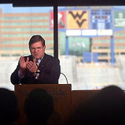 WVU President David C. Hardesty Jr. leads a round of applause during the announcement of Milan Puskar\'s gift of $20 million to the University.