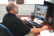 Dr. Perry Phillips scrolled through his own online degree offering, one of several courses and degree programs offered in cyberspace through WVU\'s College of Human Resources and Education. Phillips, who teaches curriculum and instruction literacy at