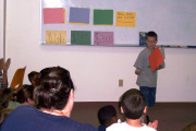 This youngster took a moment to savor the applause during this year\'s annual summer reading clinic at the College of Human Resources and Education. More than 40 children from across the region are taking part in the clinic, which is designed to targ