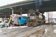 WVU researchers inside a mobile laboratory (blue vehicle) conduct emissions testing of railroad locomotives for Norfolk Southern Corp. in Roanoke, Va. 

