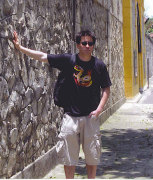 WVU journalism senior Jake Stump leans on the wall of the notorious (and now former) “ Hanoi Hilton” prison, where numerous American POWs were housed during the Vietnam War. Stump, who went to the country on a WVU Kearns Fellowship last spring