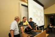 Ed Beck (center) and Loren Bradley (right) of WVU Classroom Technology show Eugene Cilento, dean of WVU\'s College of Engineering and Mineral Resources, how to use the multimedia lectern in the Mineral Resources Building. This summer, 11 classrooms a