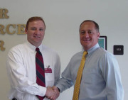 Steve Alford, 1987 WVU graduate in chemical engineering (left) met recently with Dave Durham, director of corporate relations and career assistance for the WVU College of Engineering and Mineral Resources, to announce WVU\'s designation as a \"T