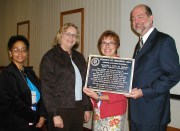 WVU\'s Charles C. Wise, Jr. Library was designated as a literary landmark during the West Virginia Library Association Annual Conference recently held in Huntington.  Receiving a plaque that notes the designation are, from left, Martha Yancey, head o
