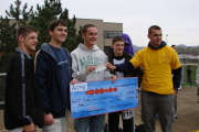 Doddridge County students Matt Robinson, Cody Hall, Greg Reed, and Dakota Hinterer (l-r) pick up their $50 first place prize from ASME chapter president Jonathan Painter (far right) after winning the WVU Pumpkin Drop Friday (Oct. 27).

