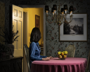 WOMAN IN ROSE DINING ROOM