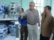 WVU professor Bob Anderson (left) examines ceramics with the president of Jingdezhen Ceramic Institute. Anderson is head of ceramics in the Division of Art and the China program coordinator.