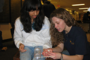 WVU student Tirzah Mills (right), a senior chemical engineering major, inspires the next generation by working with an eighth grade student during last year\'s Eighth Grade Day, part of National Engineers Week activities at the College of Engineering