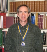 West Virginia and Regional History Collection curator John Cuthbert sports a medal he received after finishing the 111th Boston Marathon in mid-April. Cuthbert fought poor weather, leg cramps and a long climb up \"Heartbreak Hill\" to cross the 