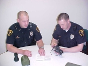 Officers Jason Broyles (left) and John Groves install batteries on new night vision goggles that were recently provided to DPS through a grant from the Department of Homeland Security. DPS recently received grants for more than $68,000 in new equipment.