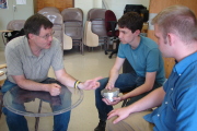 John Kuhlman, left, professor of mechanical and aerospace engineering, discusses an experiment with WVU student Tristan Wolfe, center, and recent graduate Jason Gross during last year\'s Summer Undergraduate Research Experience (SURE). Coordinated by