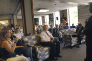 Karilynn Galiotos (left), a sophomore broadcast news major from Pittsburgh, talks about her positive first-year experience at the first of several informal forums being held by WVU President-elect Mike Garrison (right, taking notes).  Approximately 200 pe