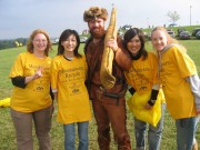 Sporting their bright gold, \"Mountaineers Recycle\" T-shirts, international students with the Intensive English Program at WVU pose with University mascot, Brady Campbell. The IEP students interested in the environment are known as West Virgini