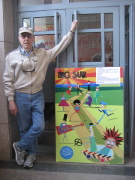 WVU Benedum Professor of Theatre Frank Gagliano stands at an entrance to Peking University with the poster for his play, \"Big Sur.\" It was the first contemporary American play to be produced at the Chinese university, and Gagliano was the firs