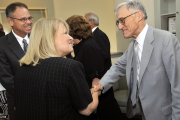 WVU Interim President C. Peter Magrath greets Dean of Extended Learning Sue Day-Perroots and Interim Dean of the College of Business and Economics Bill Trumbull, also pictured, prior to a luncheon Wednesday (July 16) -- Magrath\'s second day on the j