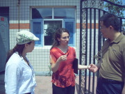 WVU law student Natalie Wright (center) converses in Mandarin with two young professionals in Beijing about opportunities the opening of ACCION International will bring to the country. The Boston-based human outreach agency hired her to help open the offi