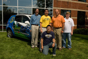 Members of WVU's EcoCAR team pose with a 2009 Saturn Vue like the one they will rebuild as part of the three-year competition. WVU is one of 17 schools participating in the competition to design a more fuel-efficient vehicle. Pictured are engineering