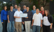 Members of WVU's EcoCAR team accept a check from their General Motors mentor to help kick off their EcoCAR efforts. From left are Cara Slider, Middlebourne; Patrick Mancini (team captain), Bristow, Va.; Luke Williams (sub-captain), St. Leonard, Md.; 