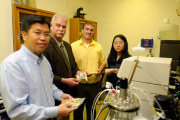 Pictured, from left: Jingxin Wang, associate professor of wood science and technology; Joseph McNeel, director, Division of Forestry and Natural Resources; Tony Goff, research assistant; and Jinzhuo Wu, doctoral candidate.