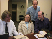 WVU Libraries staff examine a sketch in one of the books selected for a book digitization pilot project the Libraries is participating in. From left are William Rafter, head of the WVU Libraries' Cataloging Department; Frances O'Brien, dean of L