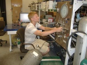 William Brezinski is shown at his internship in California running an air sample through an instrument to determine its carbon monoxide and carbon dioxide levels.