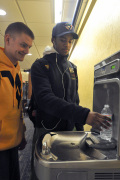 WVU students Karim Pierre and Josh Nappier try out the Mountainlair's new water bottle filling station