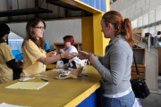 A shopper pays for her purchases at the Blue and Gold Mine Sale. All the proceeds go to the United Way of Monongalia and Preston Counties.