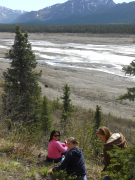  Dr. Angela Grabuloff, course instructor, and WVU students observe a grizzly bear in Denail National Park, home to Mt. McKinley.