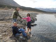 Dr. Grabuloff and WVU students Joe Gray and Arnita Sitisari sample the cool waters of Denali National Park.