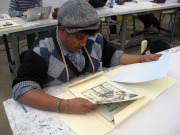 Student Alex Martin studies the portfolio