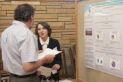 Zoie McNeill discusses her research with Dan Panaccione, professor of plant pathology in the WVU Davis College. 