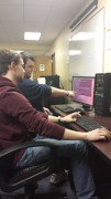 Barry Martin, a junior computer science major and president of CyberWVU, helps freshman Cameron Morris prepare for the 2014 Mid-Atlantic Collegiate Cyber Defense Competition March 26-29 in Laurel, Md