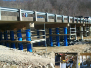 The piles of the East Fork Bridge are wrapped using glass fiber reinforced polymer composites and self-consolidating concrete