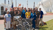 Members of West Virginia University's entry in the 2014 NASA Robotics Mining Competition are pictured with WVU alumnus and astronaut Jon McBride and Barbara Morgan, the first teacher-astronaut in space, pictured in blue