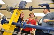 Kashy Aminian, right, professor of petroleum and natural gas engineering, instructs Jessica Spears (left) and Fatemeh Belyadi on lab components installed as a result of a recent gift from Dominion Resources and the Dominion Foundation