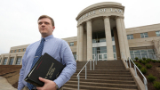 WVU student in front of College of Law