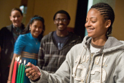 Kwanzaa-Students light candles in celebration of Kwanzaa